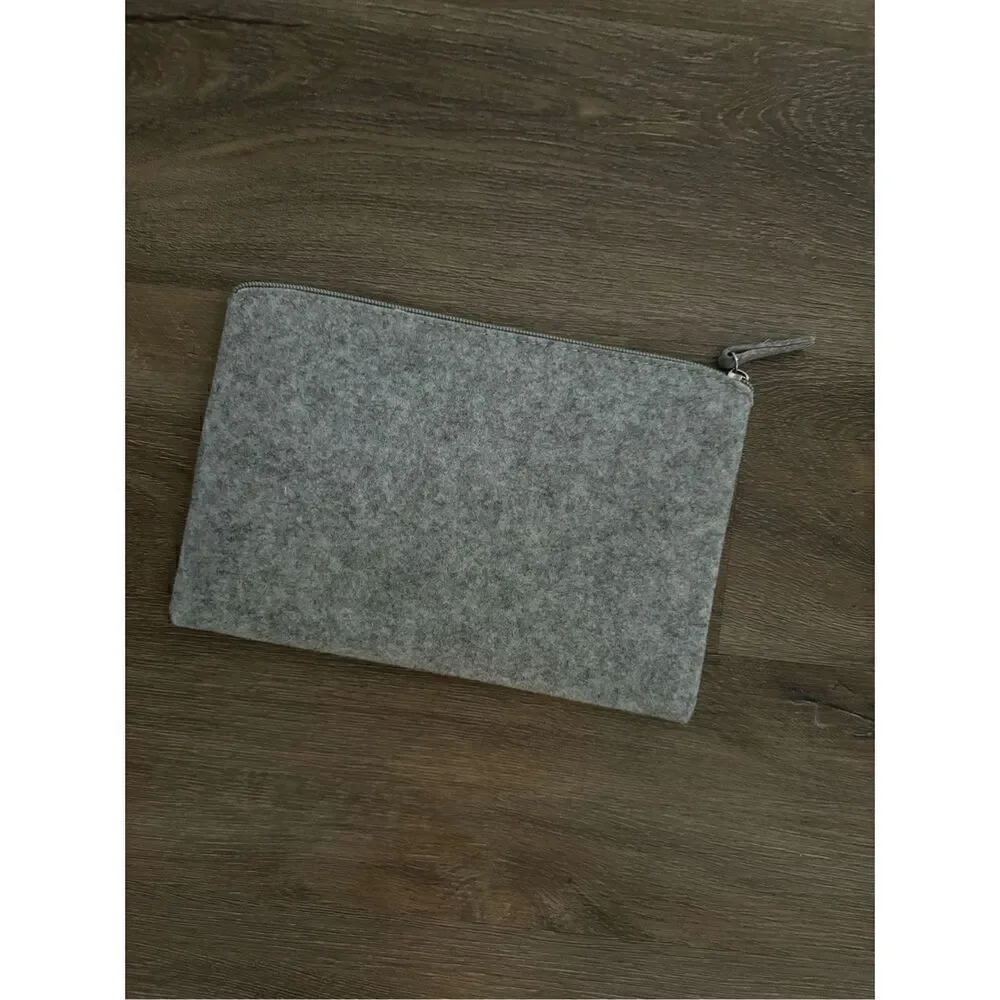 Slnghr Zip Clutch Bag Nothing Is Real